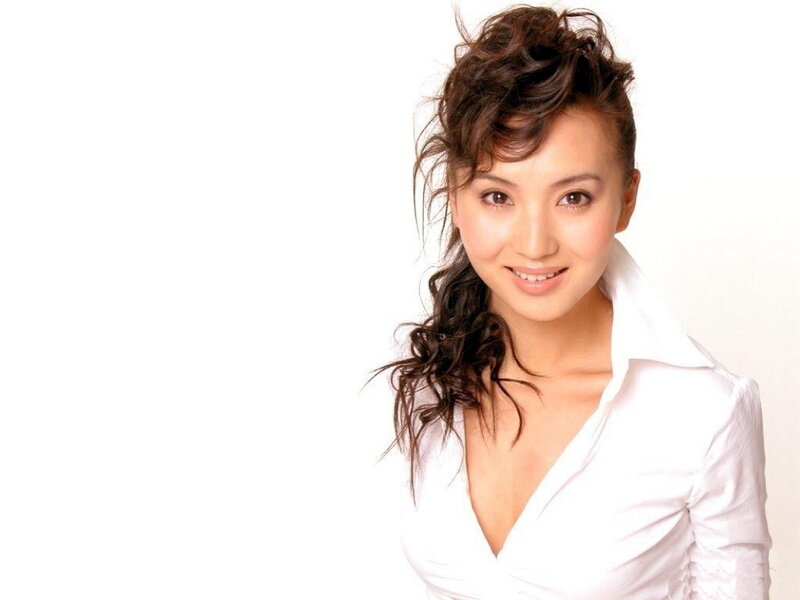 woman in white shirt smiling