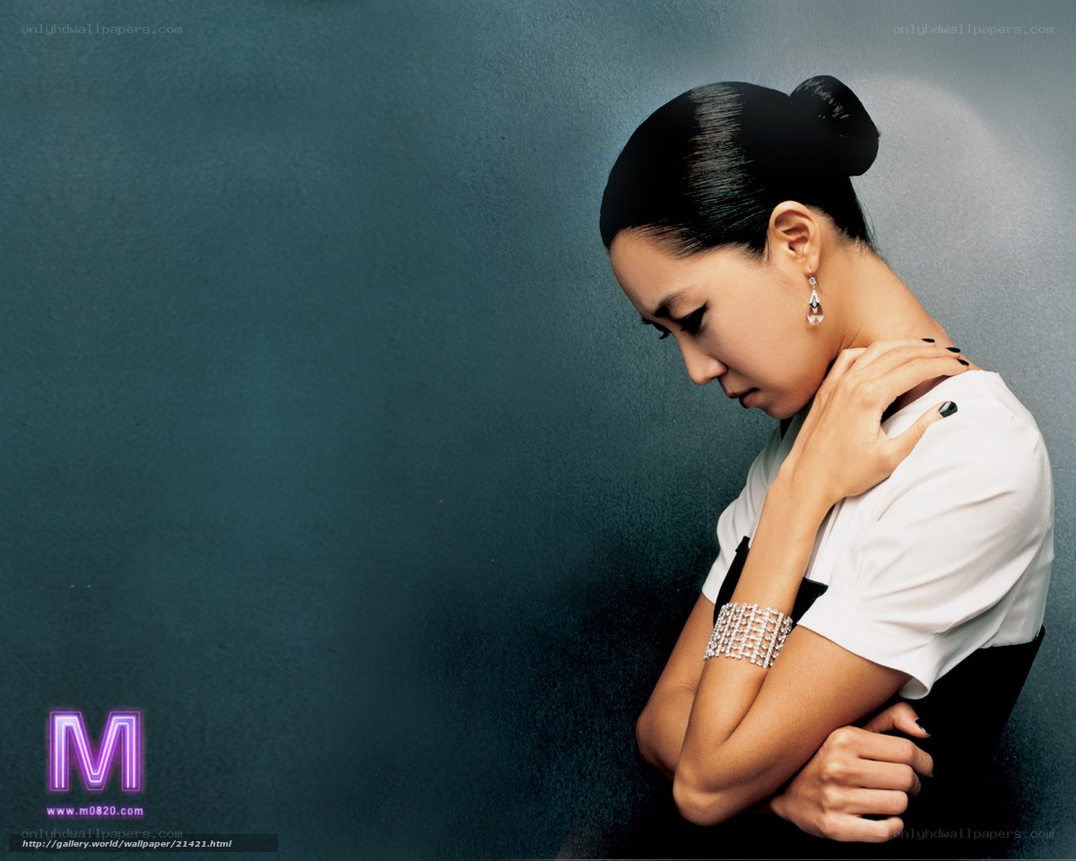 woman in white shirt with jewelry