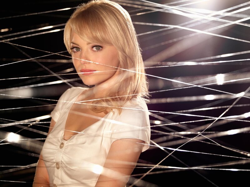Woman in white shirt with light strings