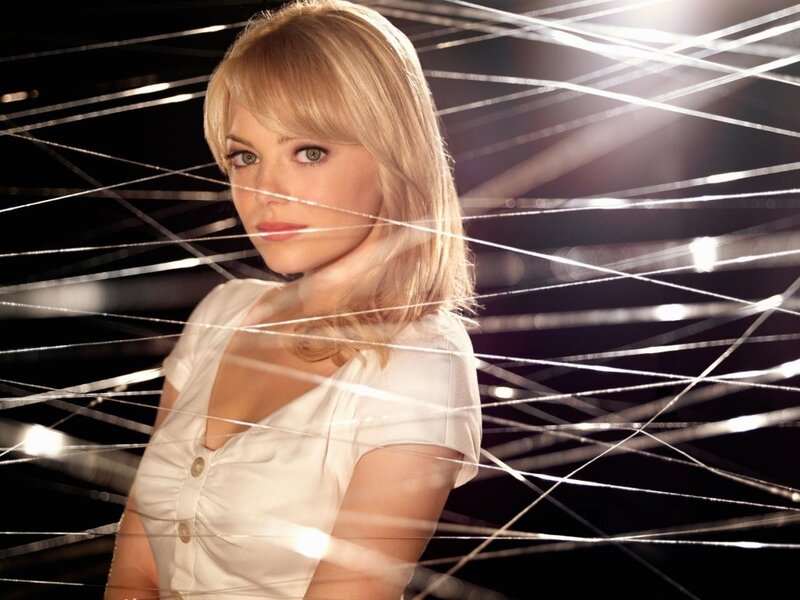 Woman in white shirt with light strings