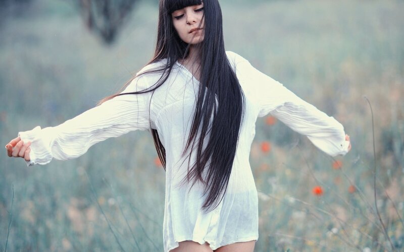 woman in white shirt with long hair