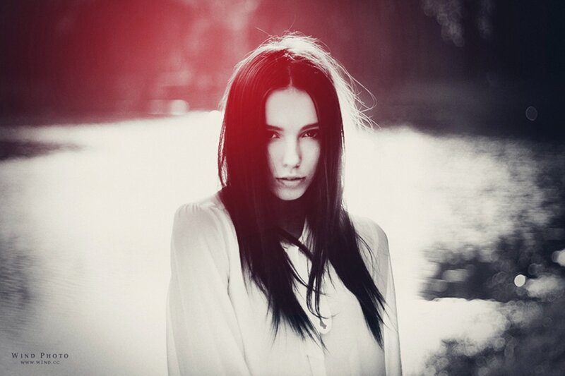 woman in white shirt with red lighting