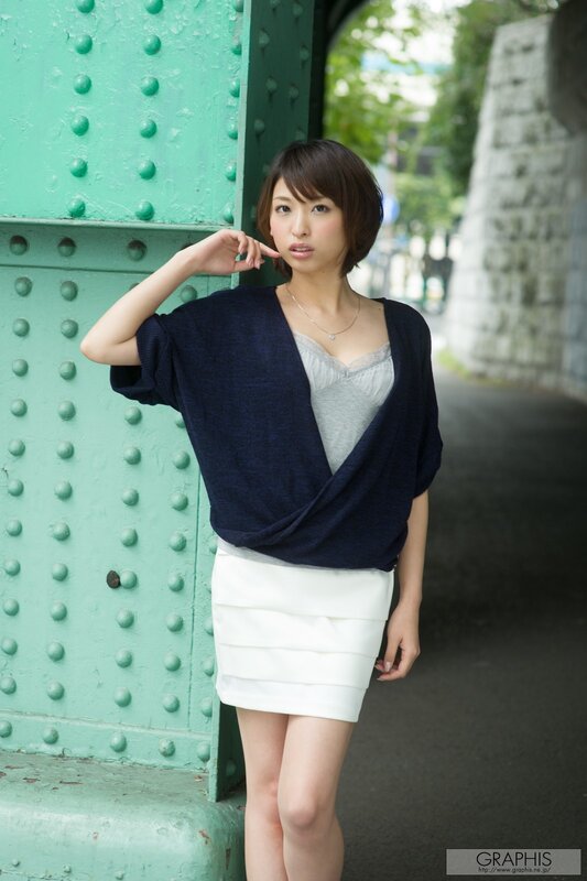 Woman in white skirt near green bridge