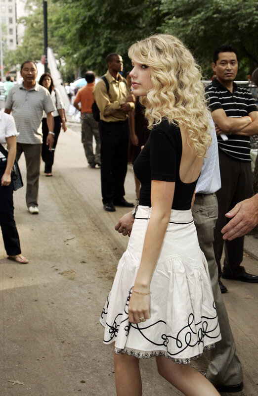 woman in white skirt walking