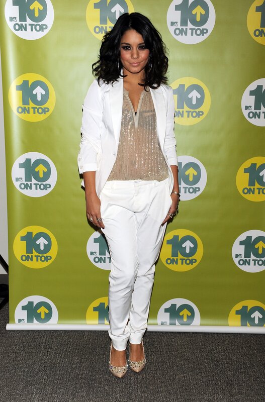 woman in white suit at event