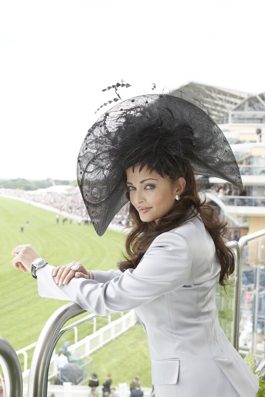 woman in white suit at racecourse