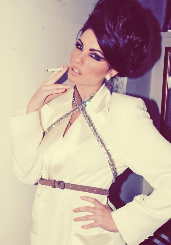 woman in white suit with cigarette