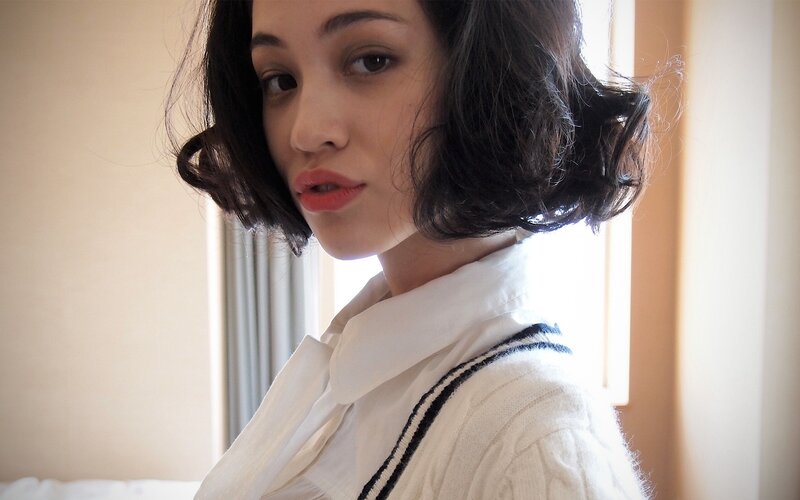 woman in white sweater