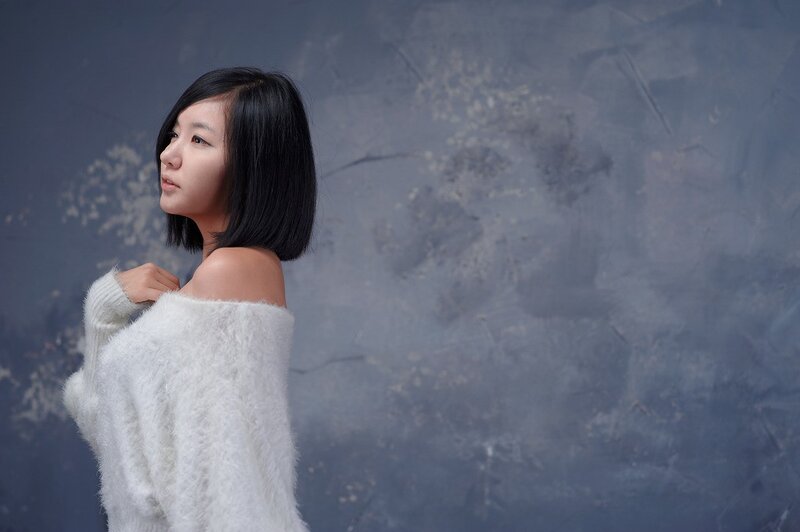 woman in white sweater