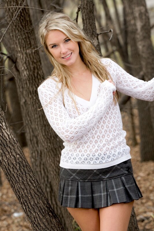 woman in white sweater and plaid skirt