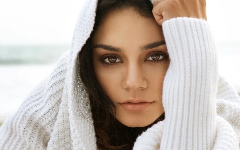 woman in white sweater at beach