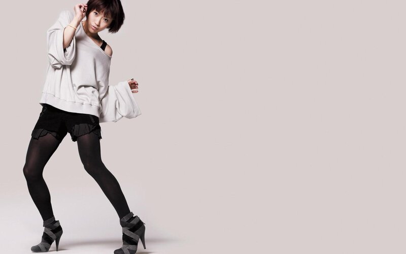 Woman in White Sweater — Confident, Photograph, Black Shorts