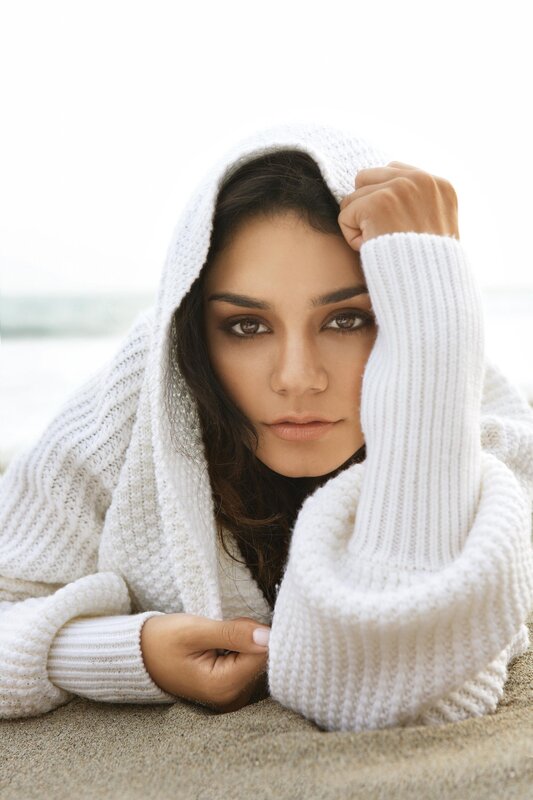 woman in white sweater on beach