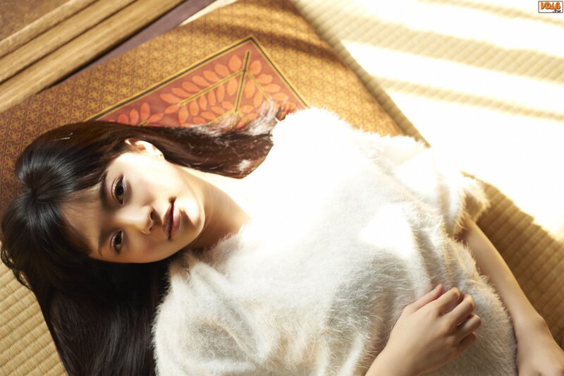 woman in white sweater on tatami
