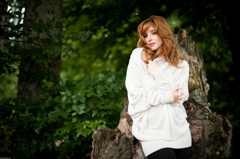 woman in white sweater outdoors