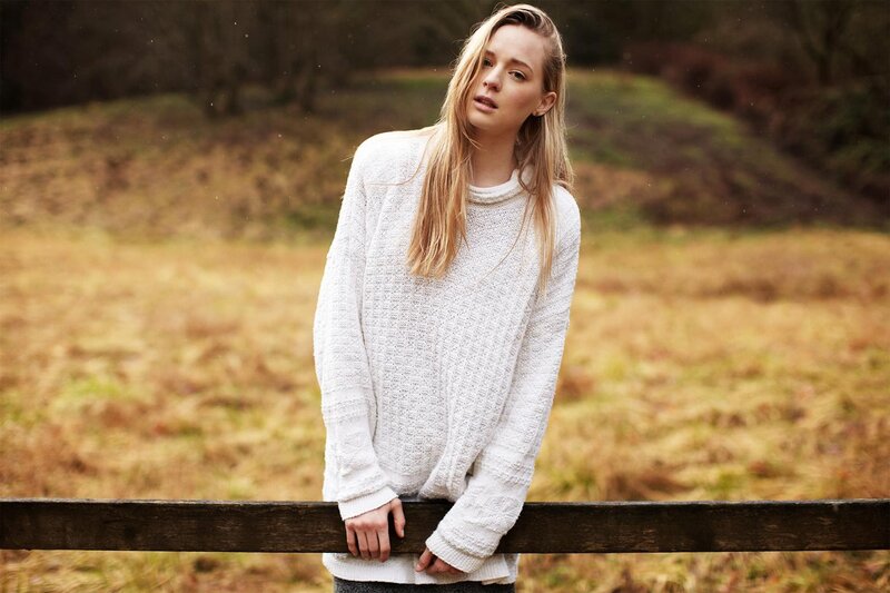 woman in white sweater outdoors