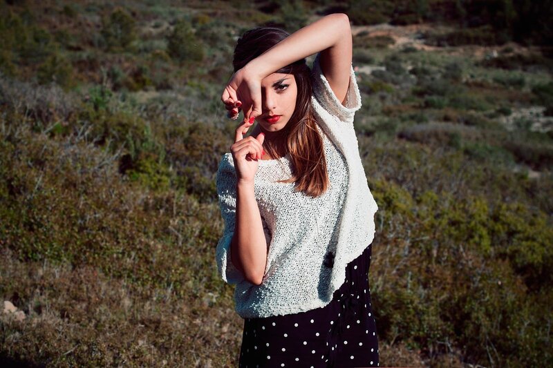 woman in white sweater outdoors