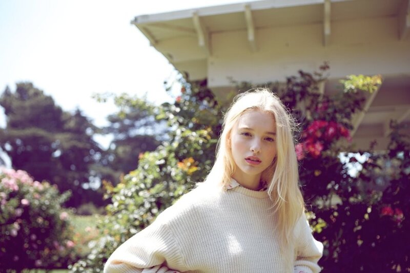 woman in white sweater outdoors