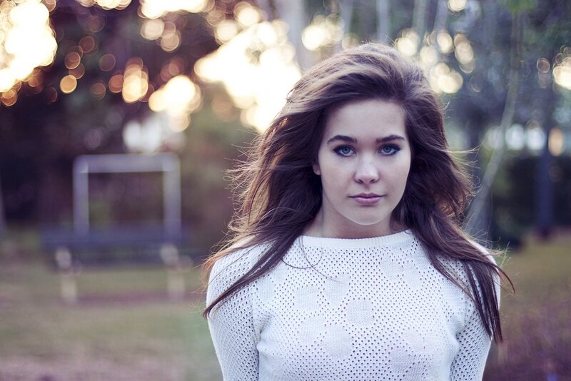 woman in white sweater outdoors