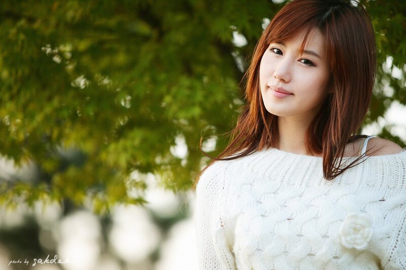 woman in white sweater outdoors