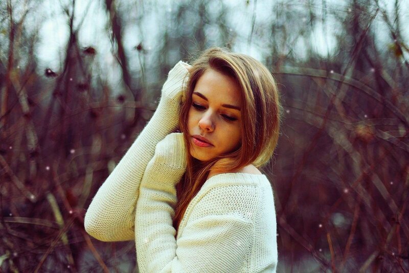 woman in white sweater outdoors