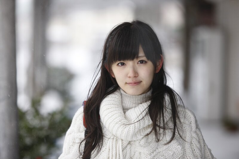 woman in white sweater outdoors