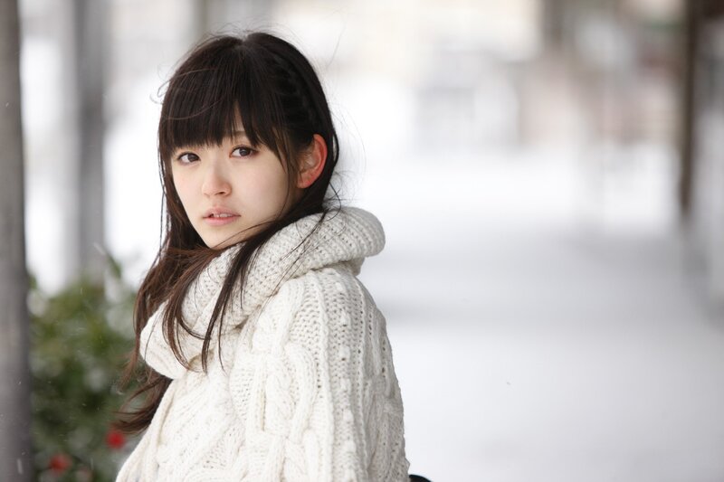 woman in white sweater outdoors
