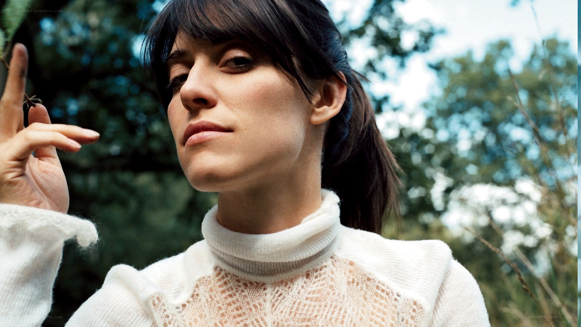woman in white sweater outdoors