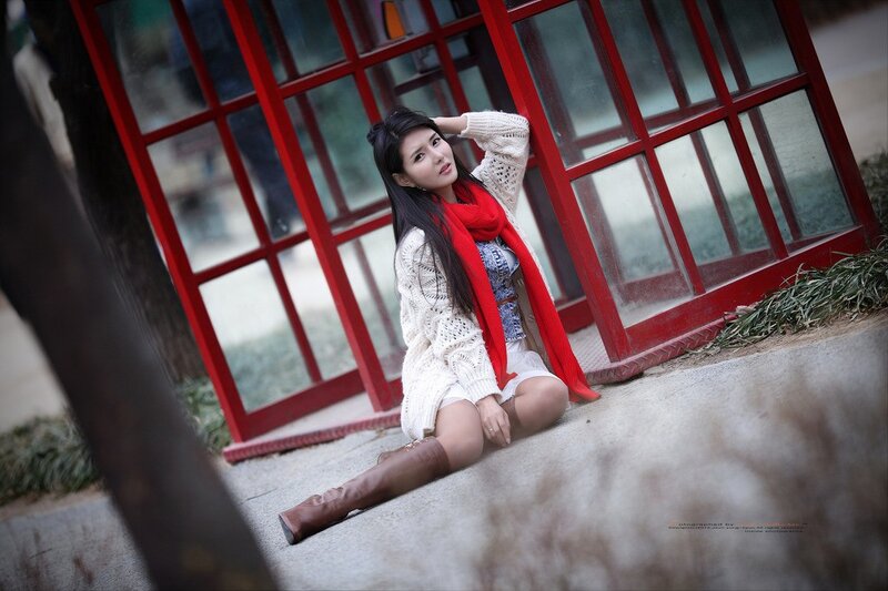 woman in white sweater sitting