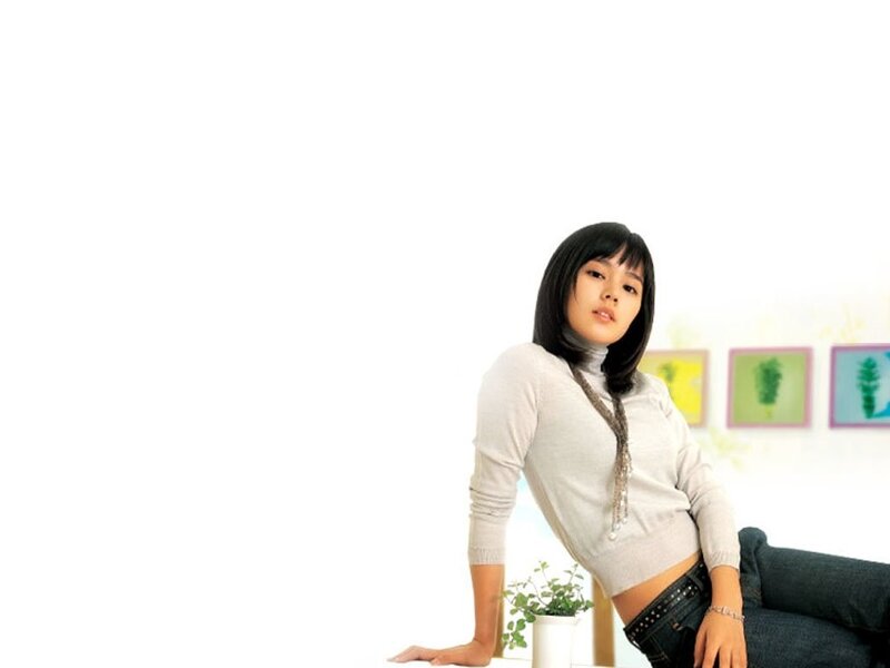 woman in white sweater sitting