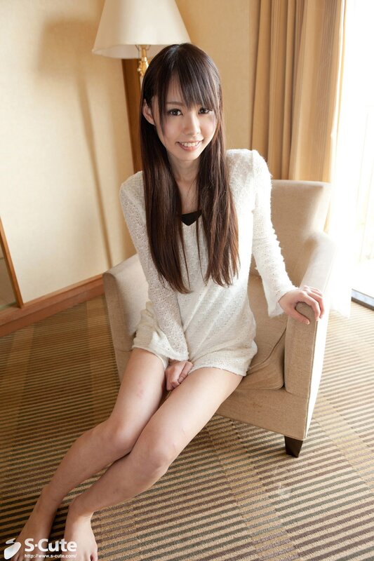 woman in white sweater sitting