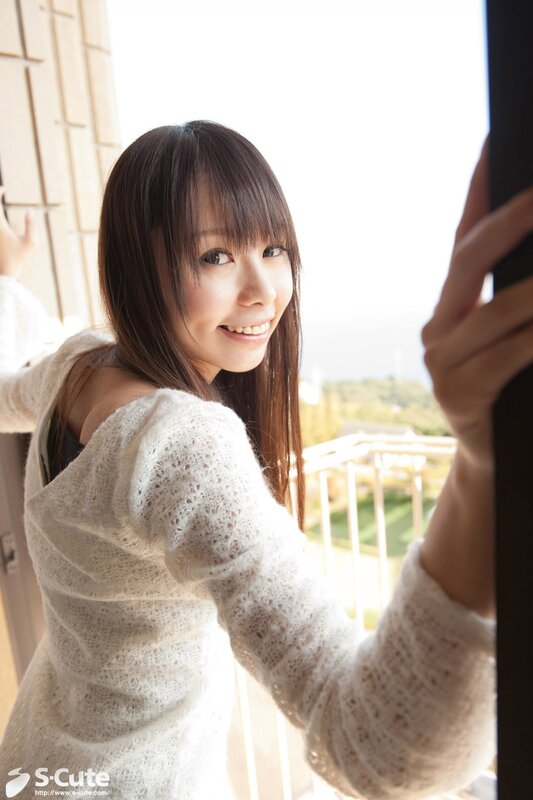 woman in white sweater smiling
