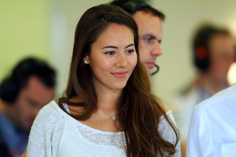 woman in white sweater smiling