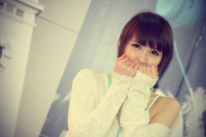 woman in white sweater smiling
