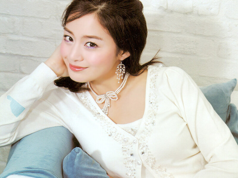 woman in white sweater smiling