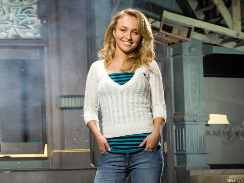 woman in white sweater smiling