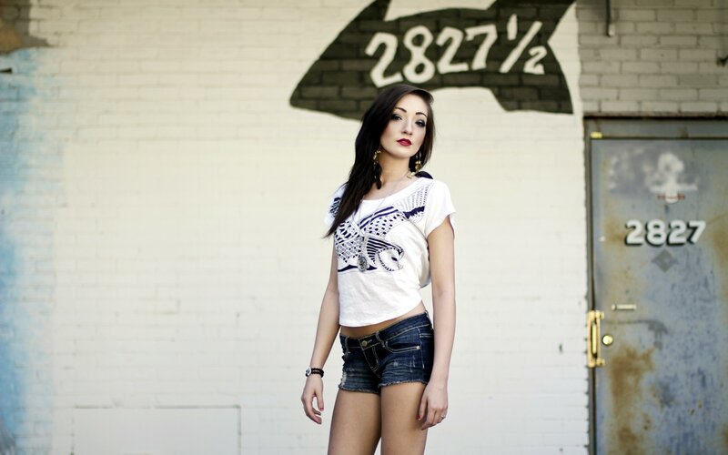 woman in white t-shirt and denim shorts