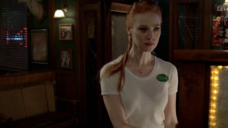woman in white t-shirt at bar