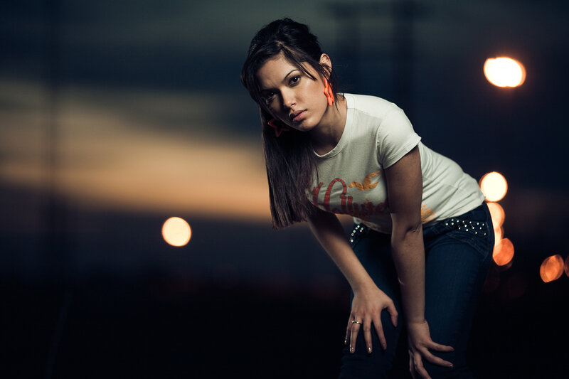 woman in white t-shirt at night
