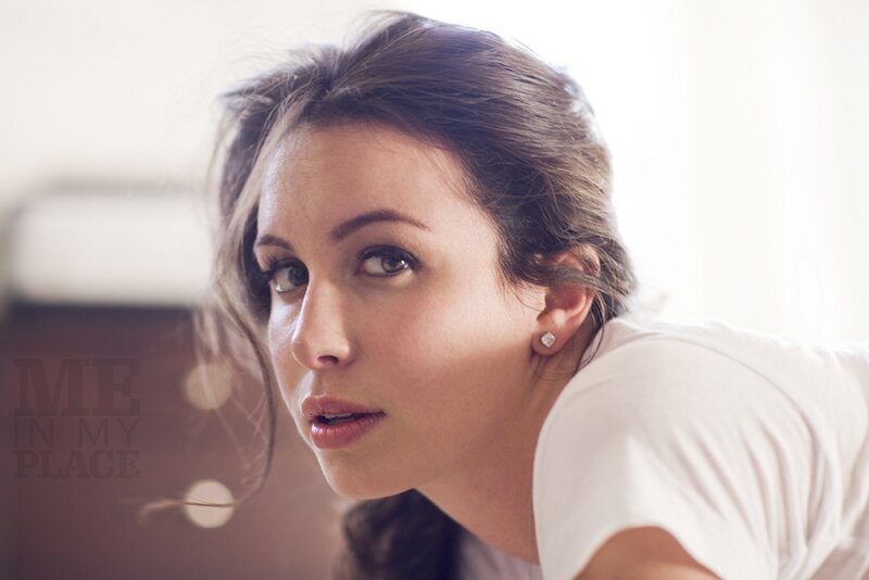 woman in white t-shirt looking at camera