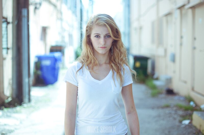 woman in white t-shirt on alleyway