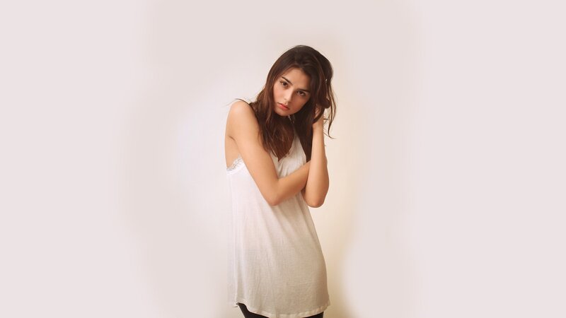 woman in white top