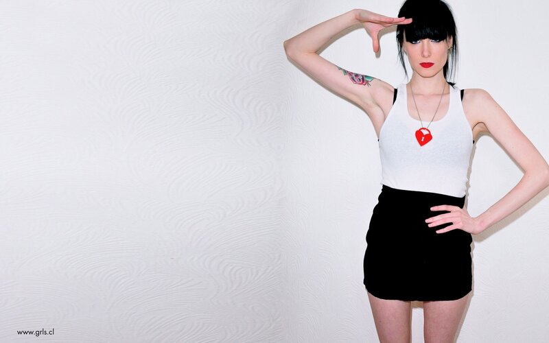 woman in white top and black skirt