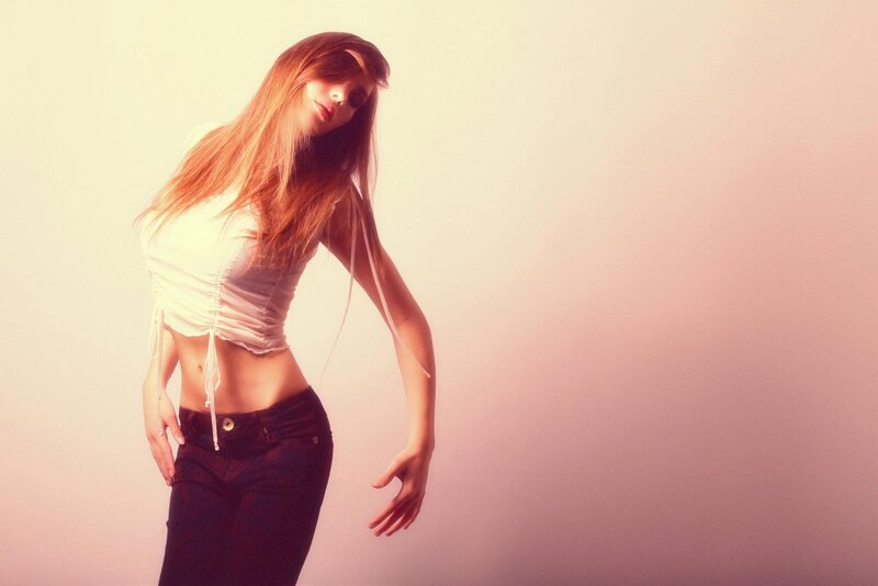 woman in white top and jeans