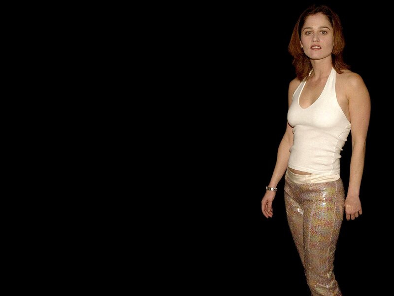 woman in white top and sequined pants