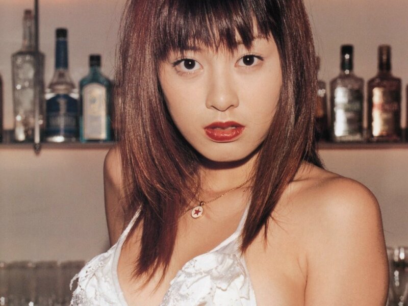 woman in white top at bar