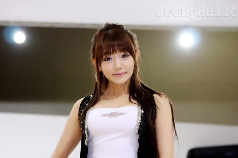woman in white top at event