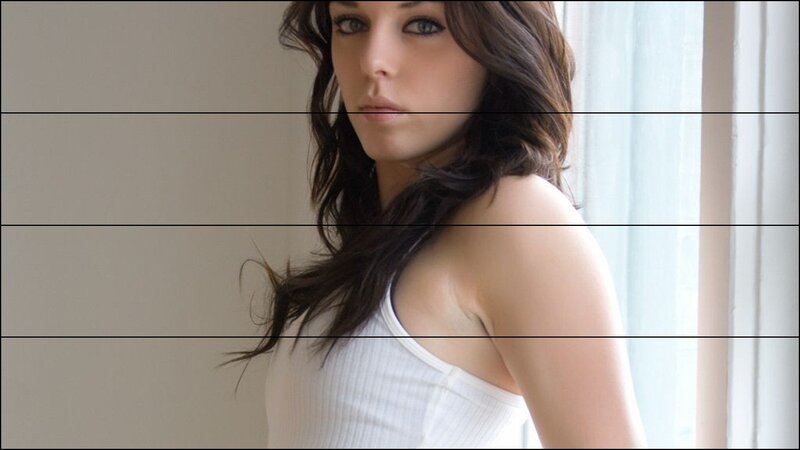 woman in white top by window