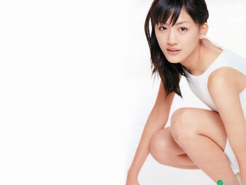 woman in white top crouching