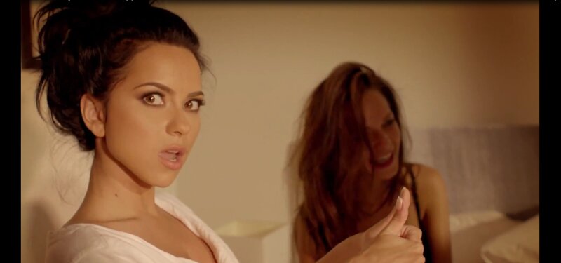 woman in white top looking surprised